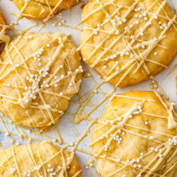cookies with white chocolate drizzle and white sprinkles