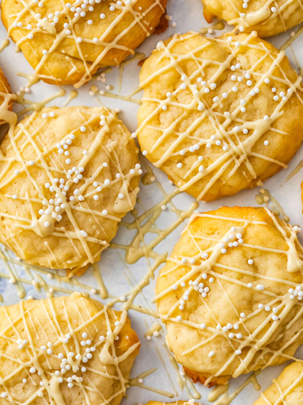 cookies with white chocolate drizzle and white sprinkles