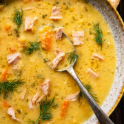 top down view split pea and ham soup in a bowl with a spoon in it