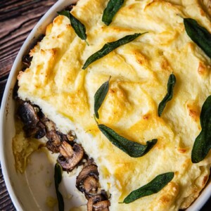 Mashed Potato Casserole with Mushrooms showing in the middle layer
