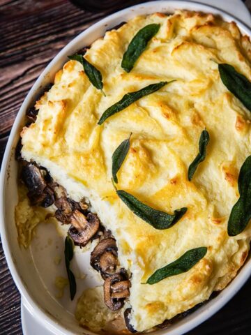 Mashed Potato Casserole with Mushrooms showing in the middle layer