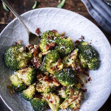 roasted broccoli with sun-dried tomatoes in grey bowl