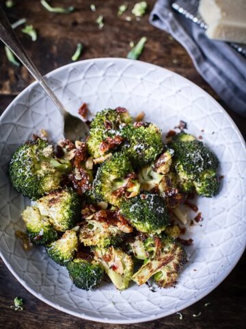 roasted broccoli with sun-dried tomatoes in grey bowl
