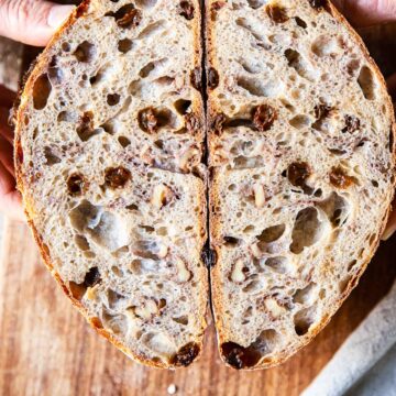 walnut and raisin bread cut in halh