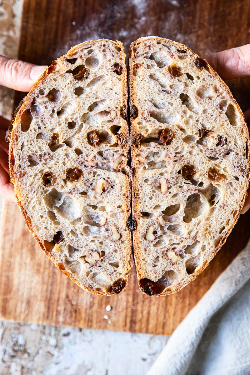 walnut and raisin bread cut in halh