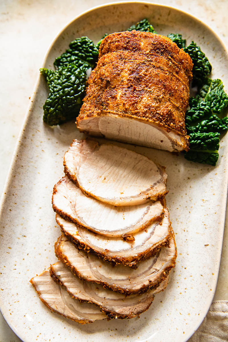 top down view of roasted and partially sliced pork loin