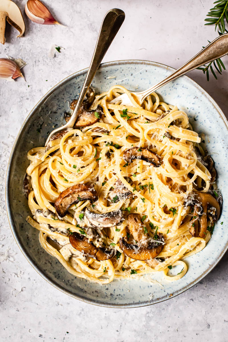 top down view of a bowl with pasta and mushrooms