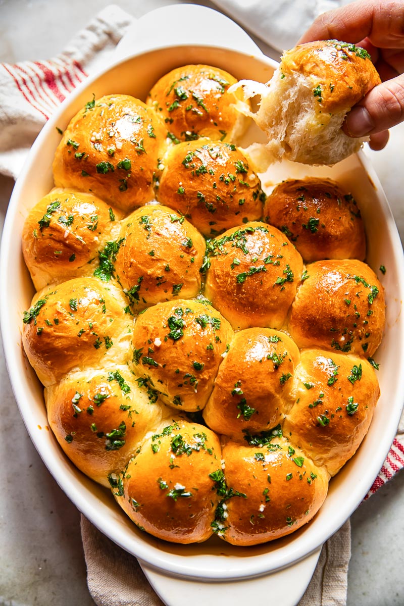 tear and share bread in a pan