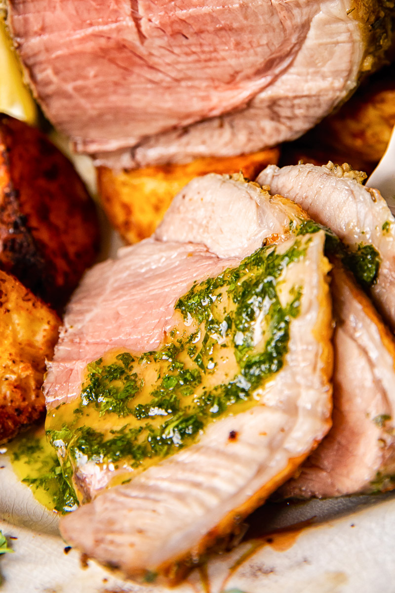 mint sauce spread over a slice of roast lamb