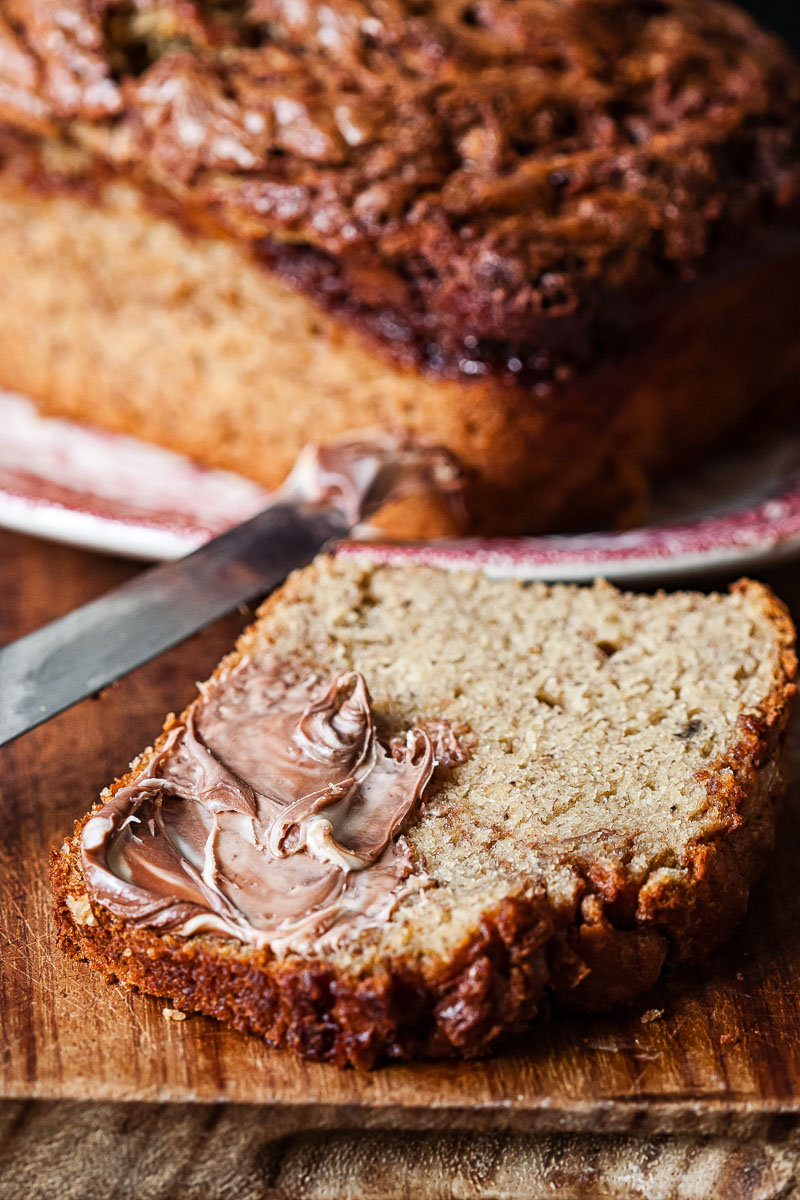 a slice of banana bread spread with nutella.