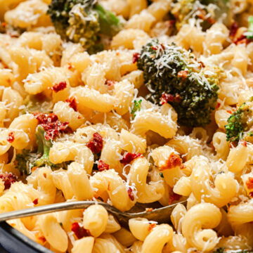 pasta with broccoli and sun-dried tomatoes in a pan