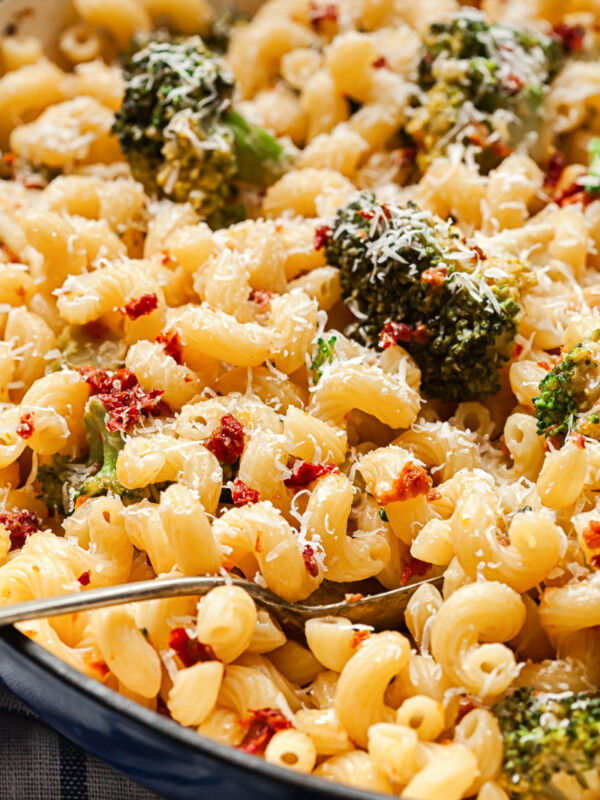 pasta with broccoli and sun-dried tomatoes in a pan