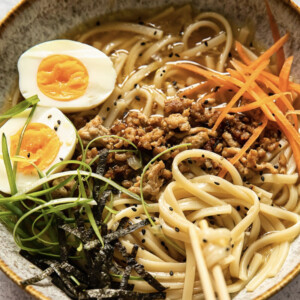 Udon noodle soup with beef, carrots and a hardboiled egg