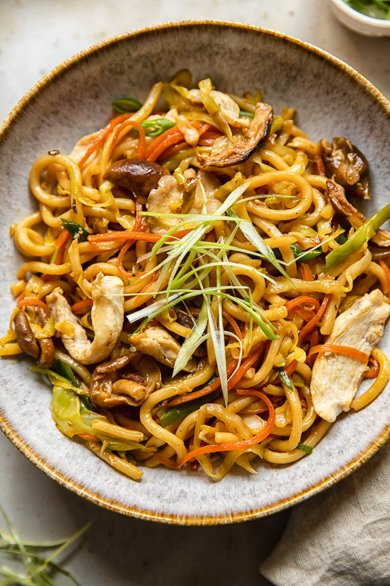 top down view of chicken yaki udon in a bowl