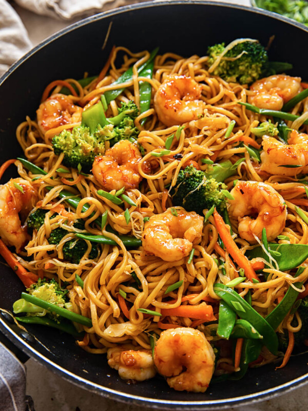 top down view of shrimp with stir fried noodles and vegetables