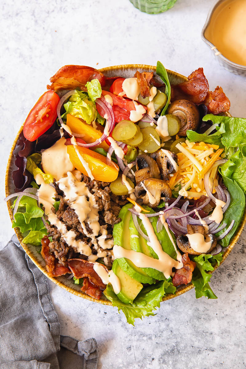 top down view of a salad with hamburger