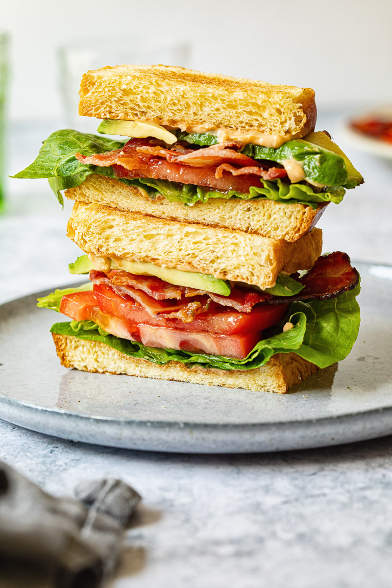 BLT sandwich cut in the half with the layers showing