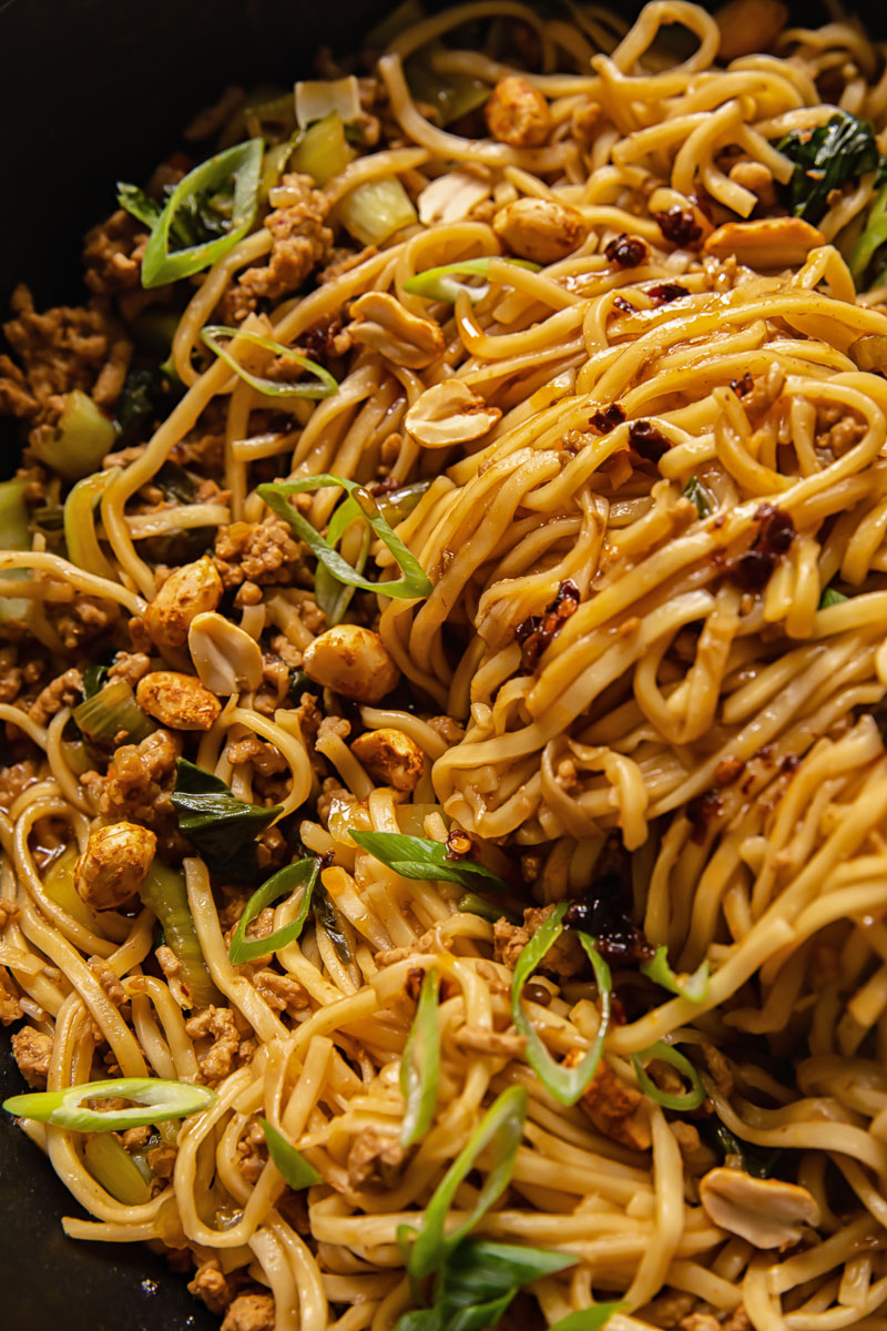 close up of a Chinese noodle dish in a wok