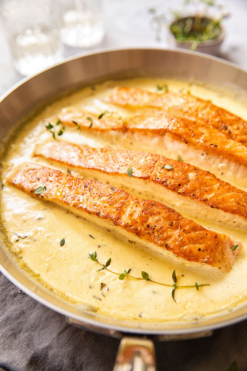 salmon in cream sauce in a pan