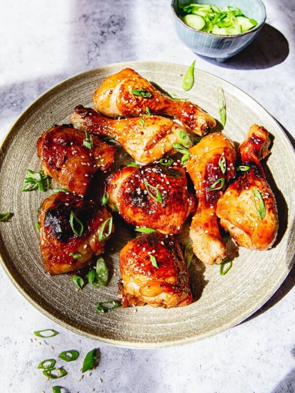 Asian chicken on grey platter on grey background