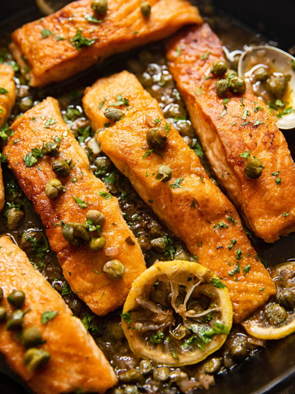 pan seared salmon topped with capers and lemon slices