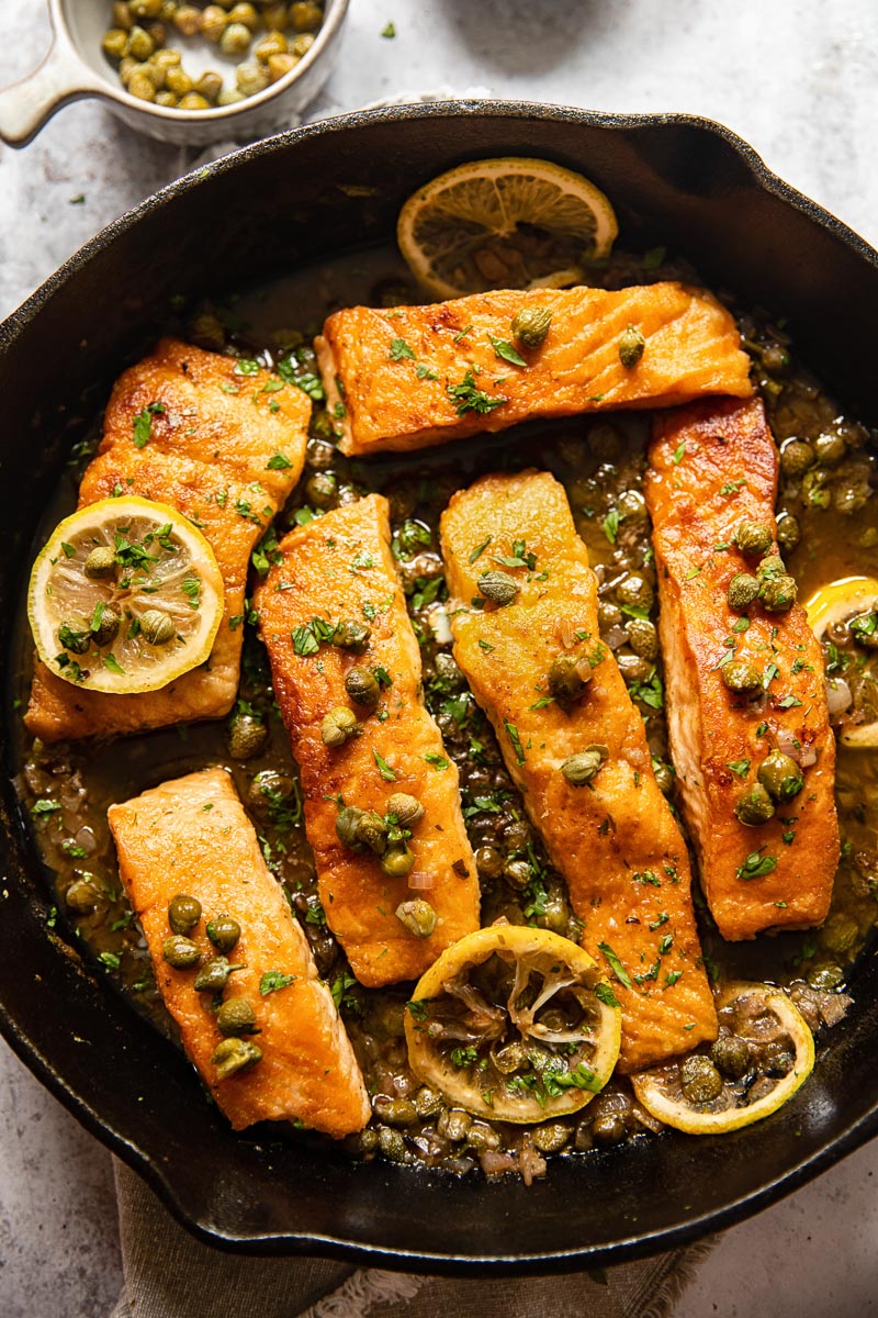 top down view of pan seared salmon with piccata sauce