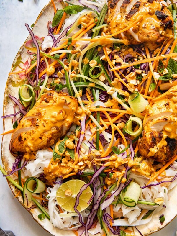 top down view of grilled chicken on top of salad