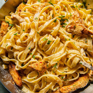 creamy pasta with chicken in a pan