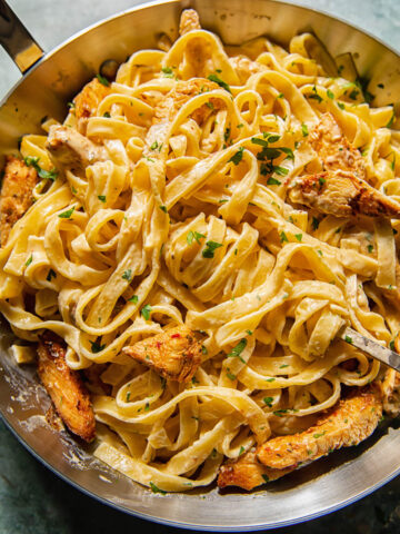 creamy pasta with chicken in a pan