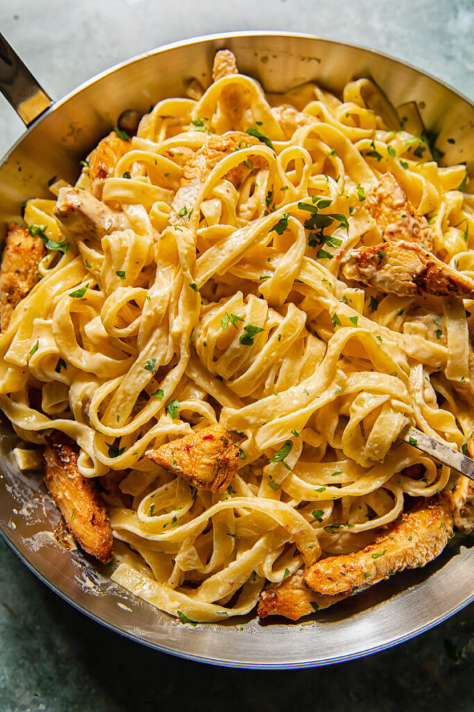 creamy pasta with chicken in a pan