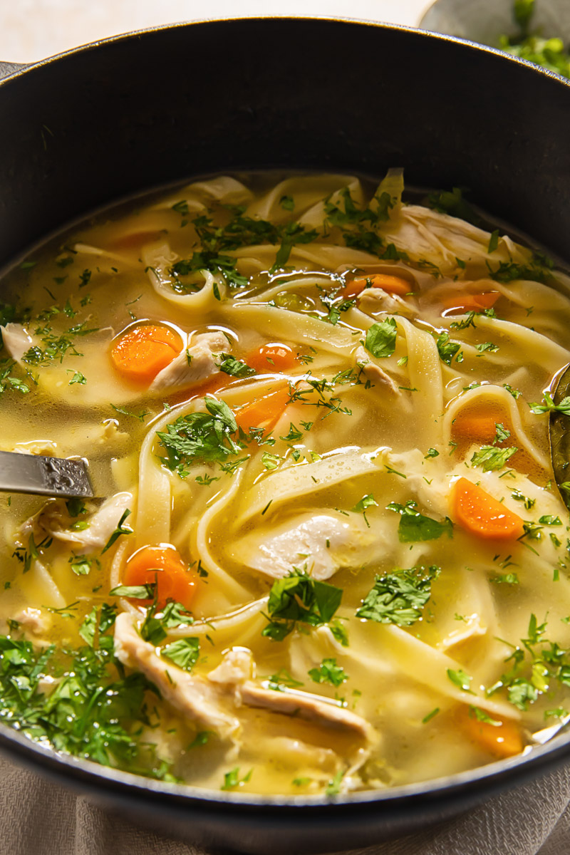 soup sprinkled with fresh herbs in a pot