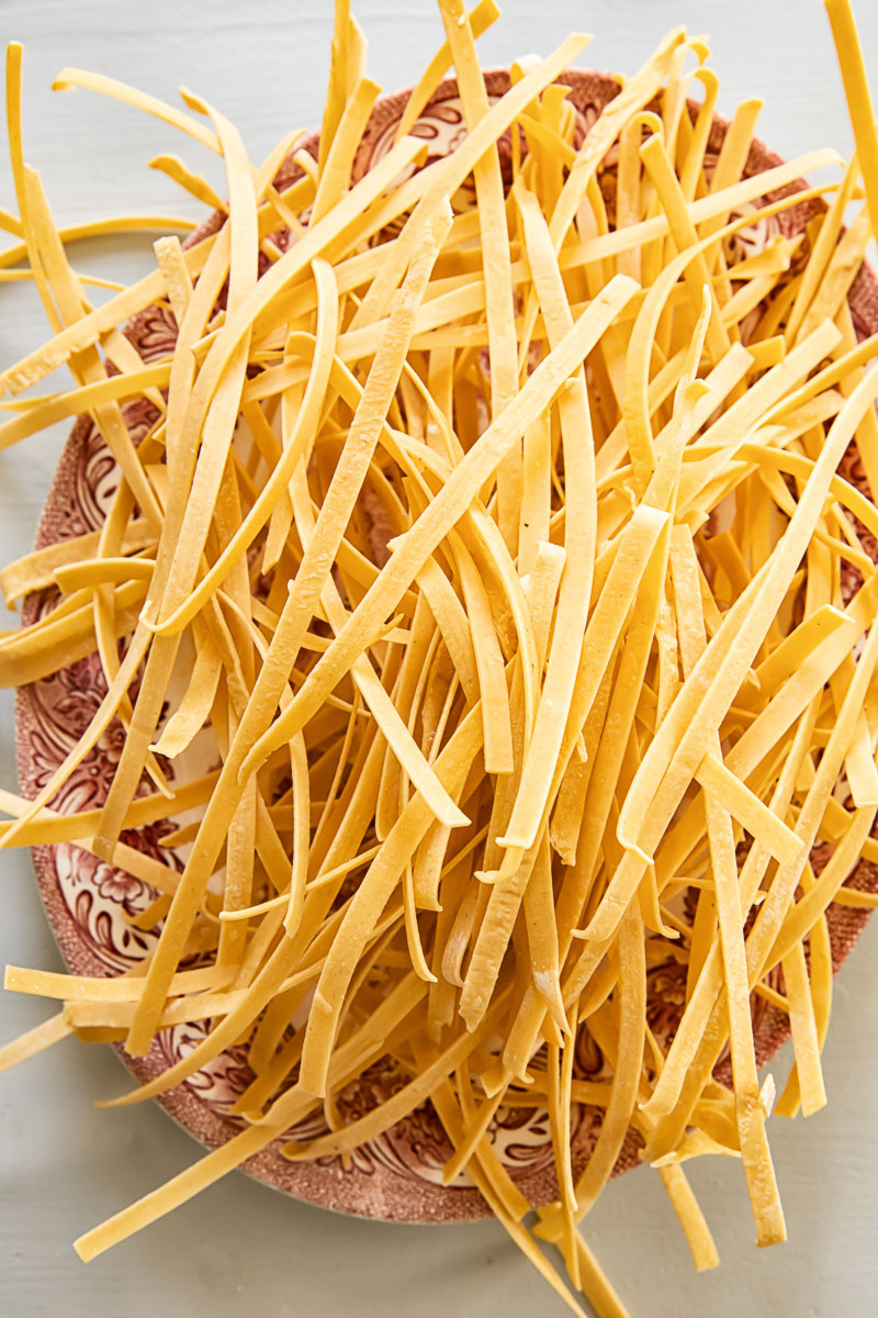 a pile of homemade noodles on a platter