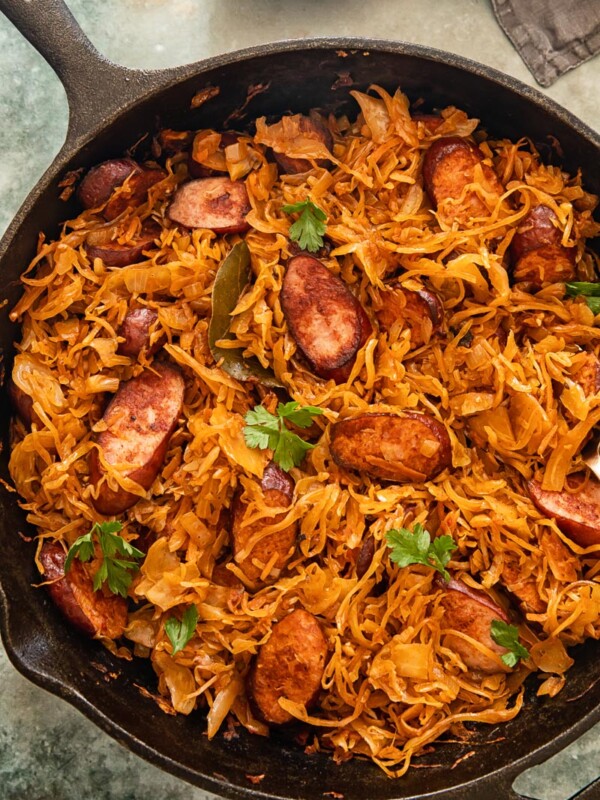 top down view of kielbasa and sauerkraut in a frying pan