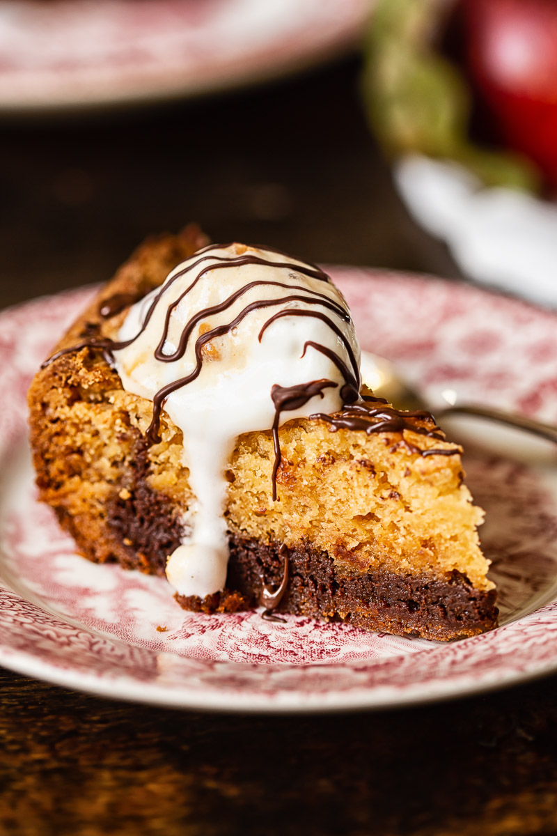 a cookie bar on a plate topped with ice cream