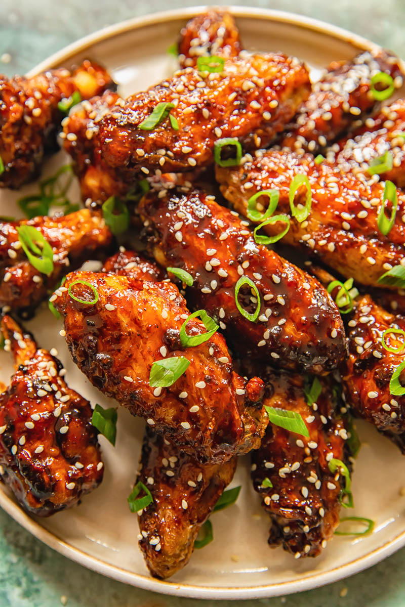 chicken wings coated in a glaze on a plate