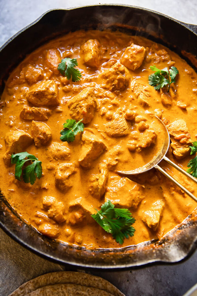 top down view of chicken curry in a pan