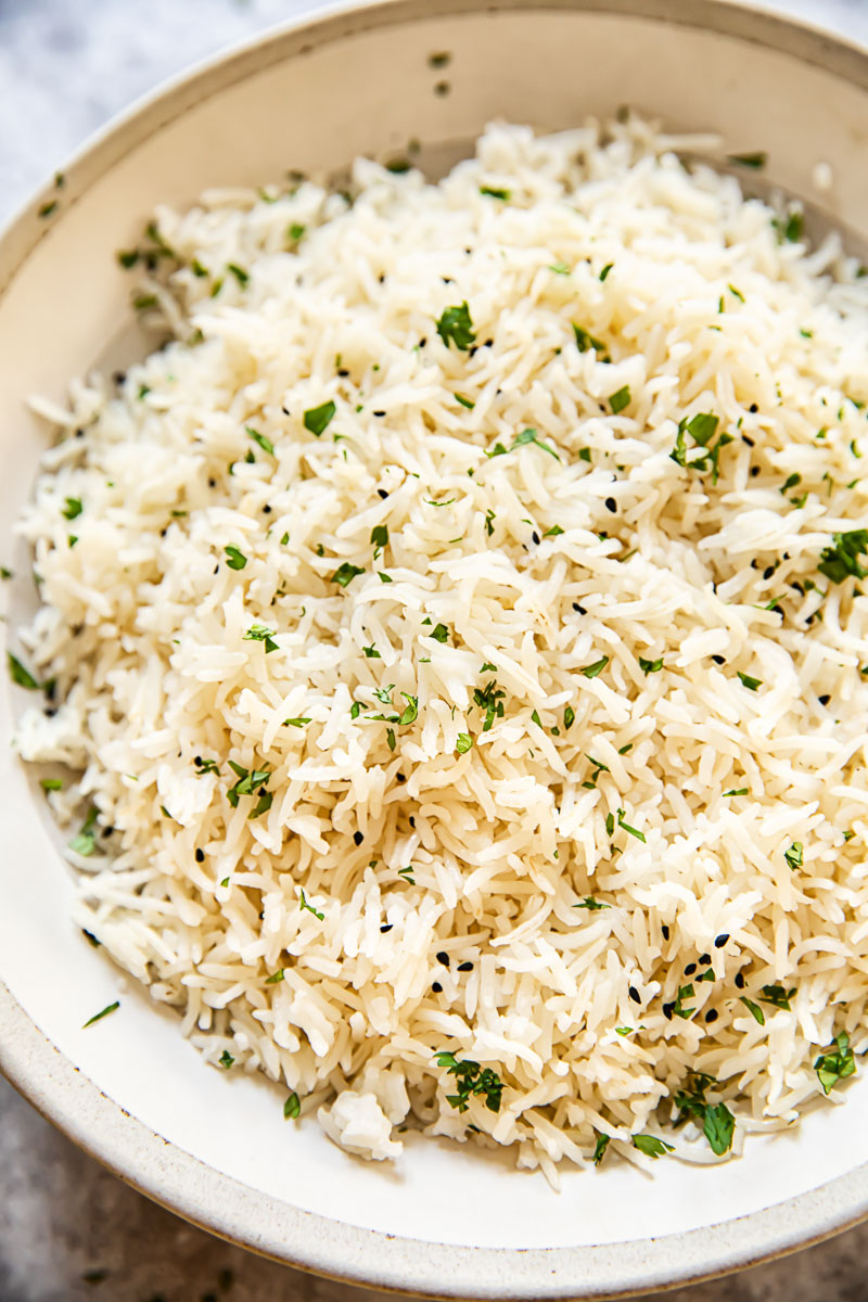 rice sprinkled with fresh cilantro in a bowl