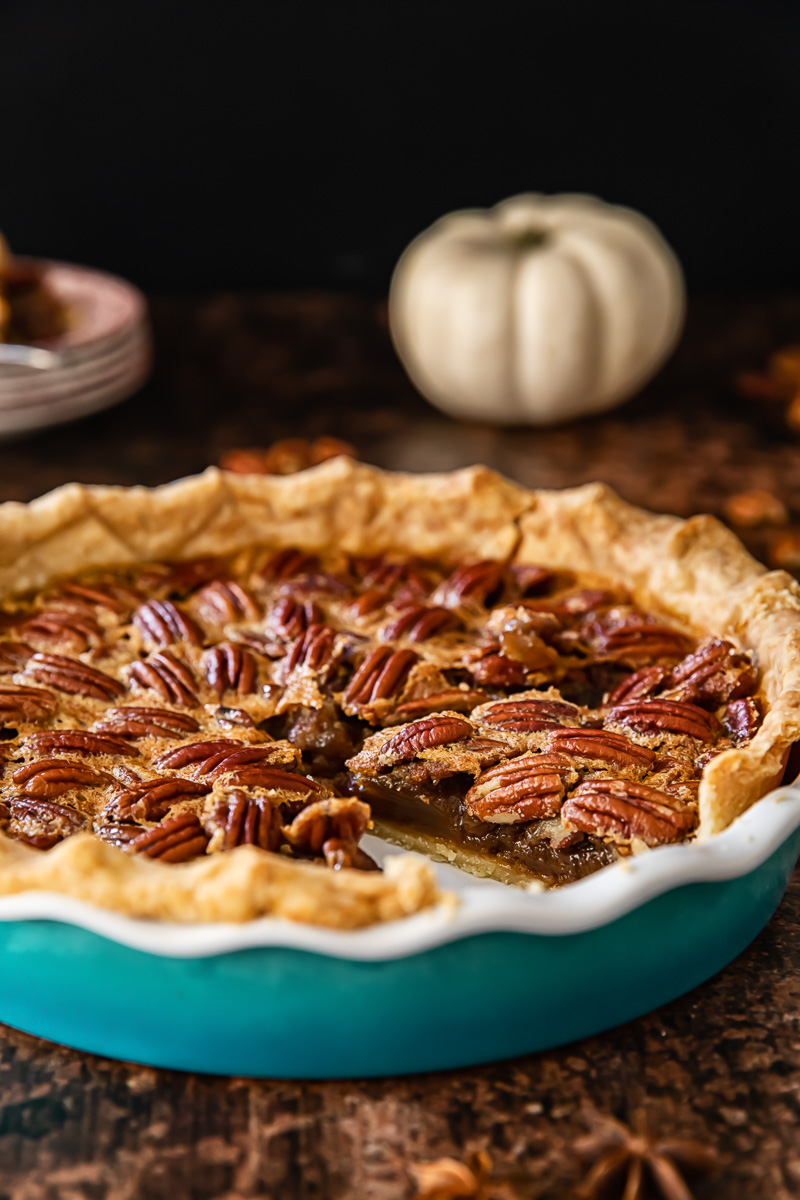 side view of pecan pie in a pie plate