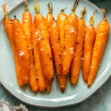 roasted carrots on a blue plate