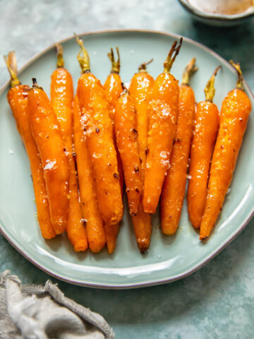 roasted carrots on a blue plate