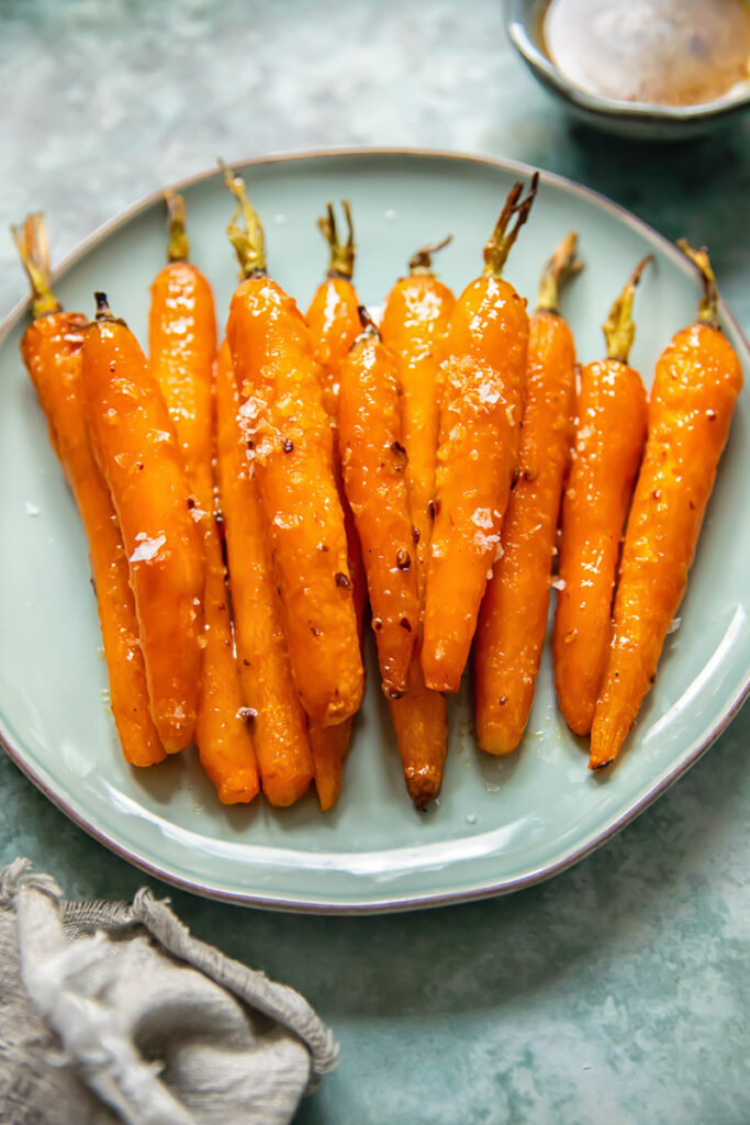 roasted carrots on a blue plate