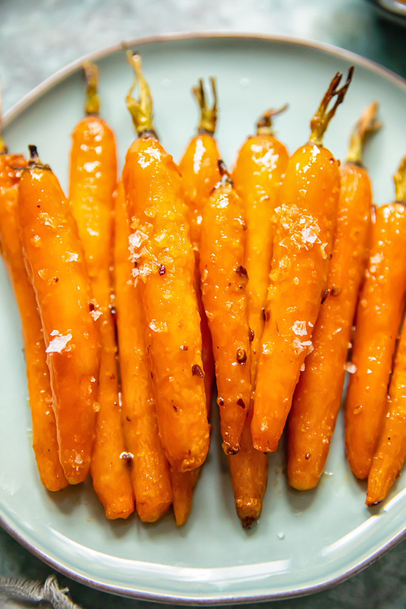 glazed carrots on blue plate