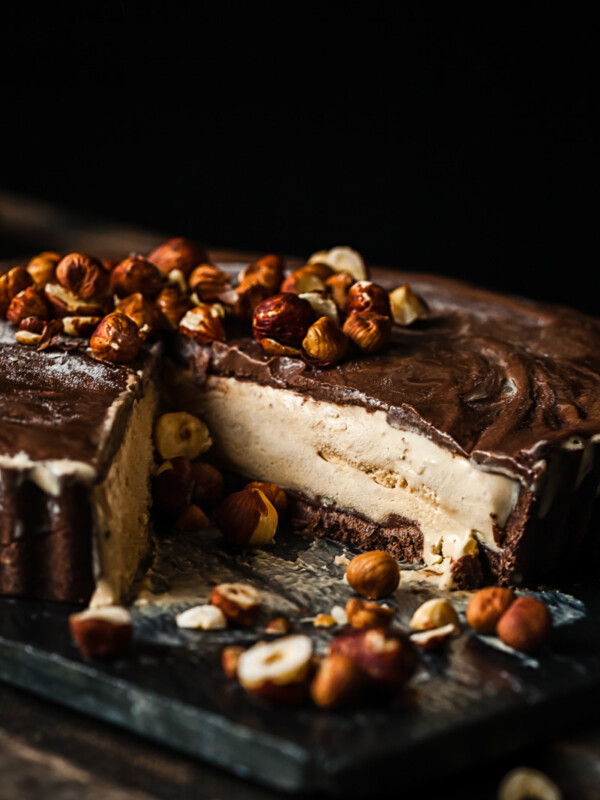 Mud pie with slice removed and nuts scattered