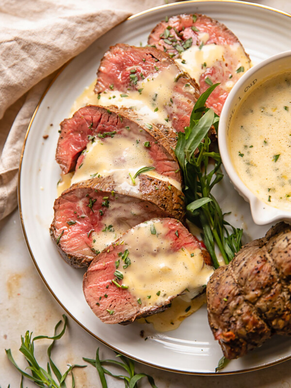 slice beef filet with sauce over it