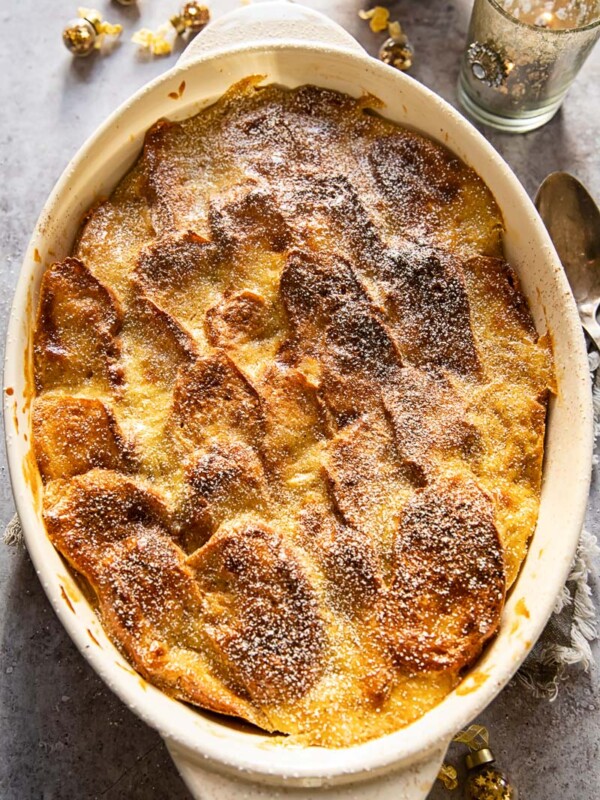 top down view of brioche bread and butter pudding in an oval casserole dish