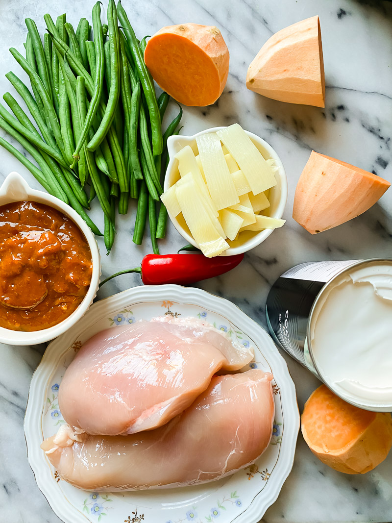 Thai chicken curry ingredients on marble