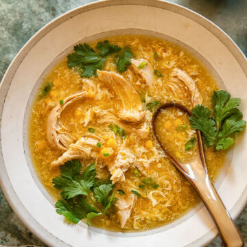 top down view of chicken and corn soup in a bowl