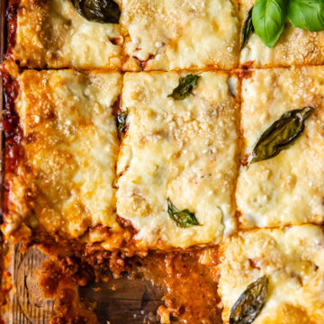 top down view of lasagne in a pan cut into squares