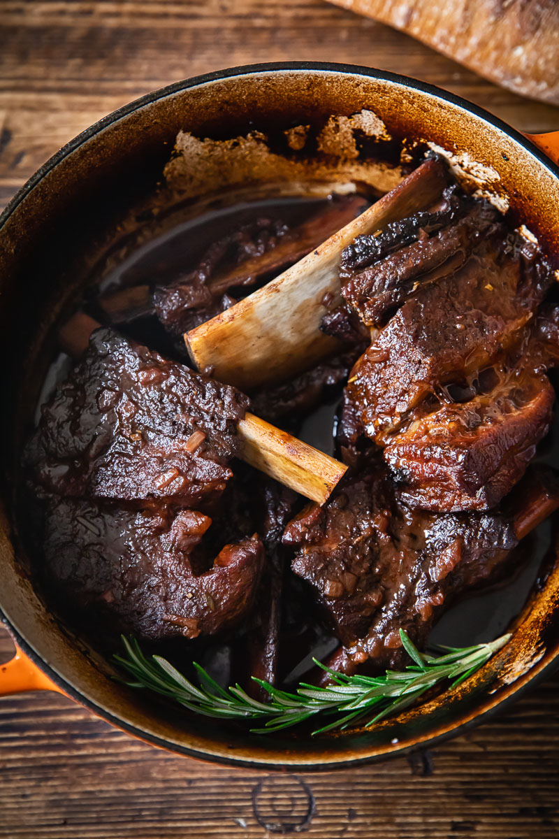 short ribs in braising liquid in a pot