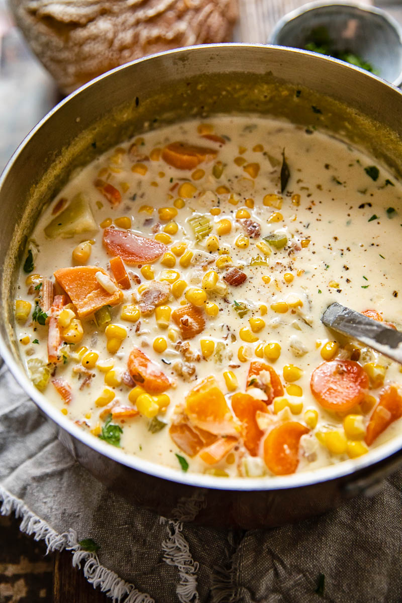 corn chowder with sweet potatoes in a soup pot